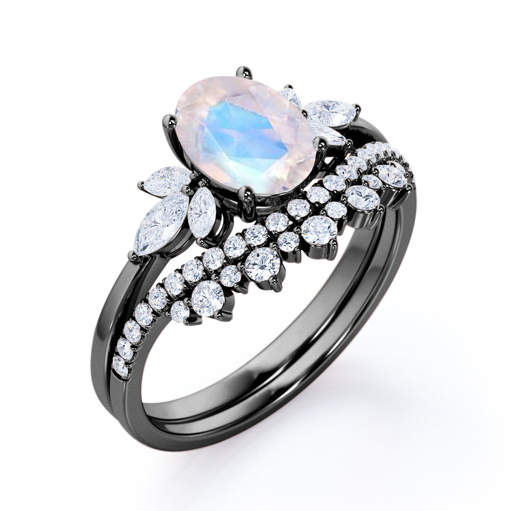 Garland Inspired 1.65 carat Oval shaped Blue Moonstone and diamond contoured seven stone Bridal set in Black gold