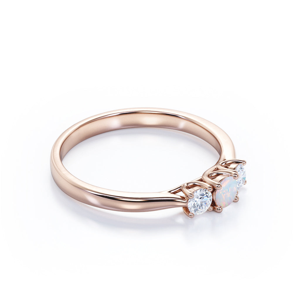 Tapered Shank 0.7 carat Round cut Ethiopian Opal and diamond triple stone engagement ring in Rose gold