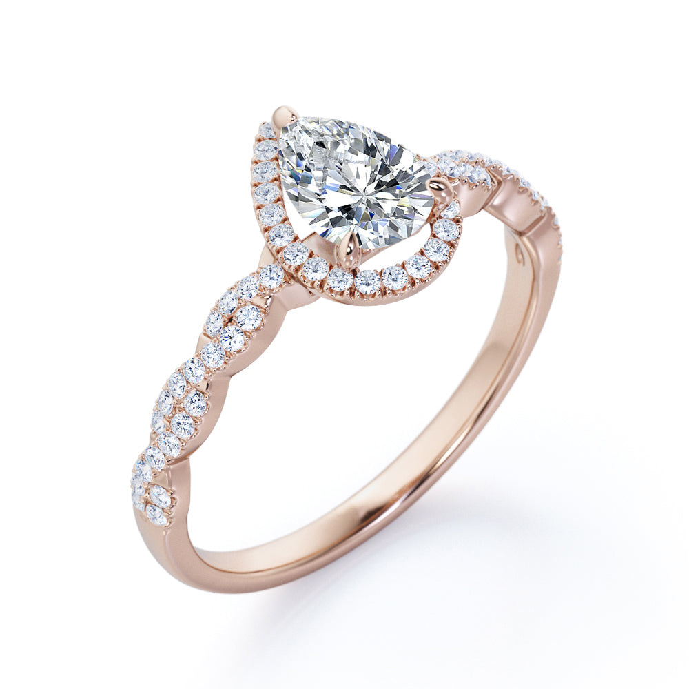 Twisted rope style 1.5 carat Pear cut Moissanite and diamond infinity halo engagement ring in Rose gold