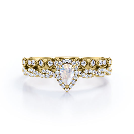 Art deco Milgrain 1.65 carat Pear cut Moonstone and diamond twisted pave engagement ring in yellow gold