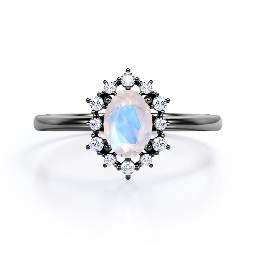 Snowflake inspired 1.25 carat Oval cut Moonstone and diamond unique halo engagement ring in Black gold