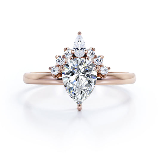 Chevron crown inspired 1.1 carat Pear shaped Moissanite and diamond engagement ring in Rose gold