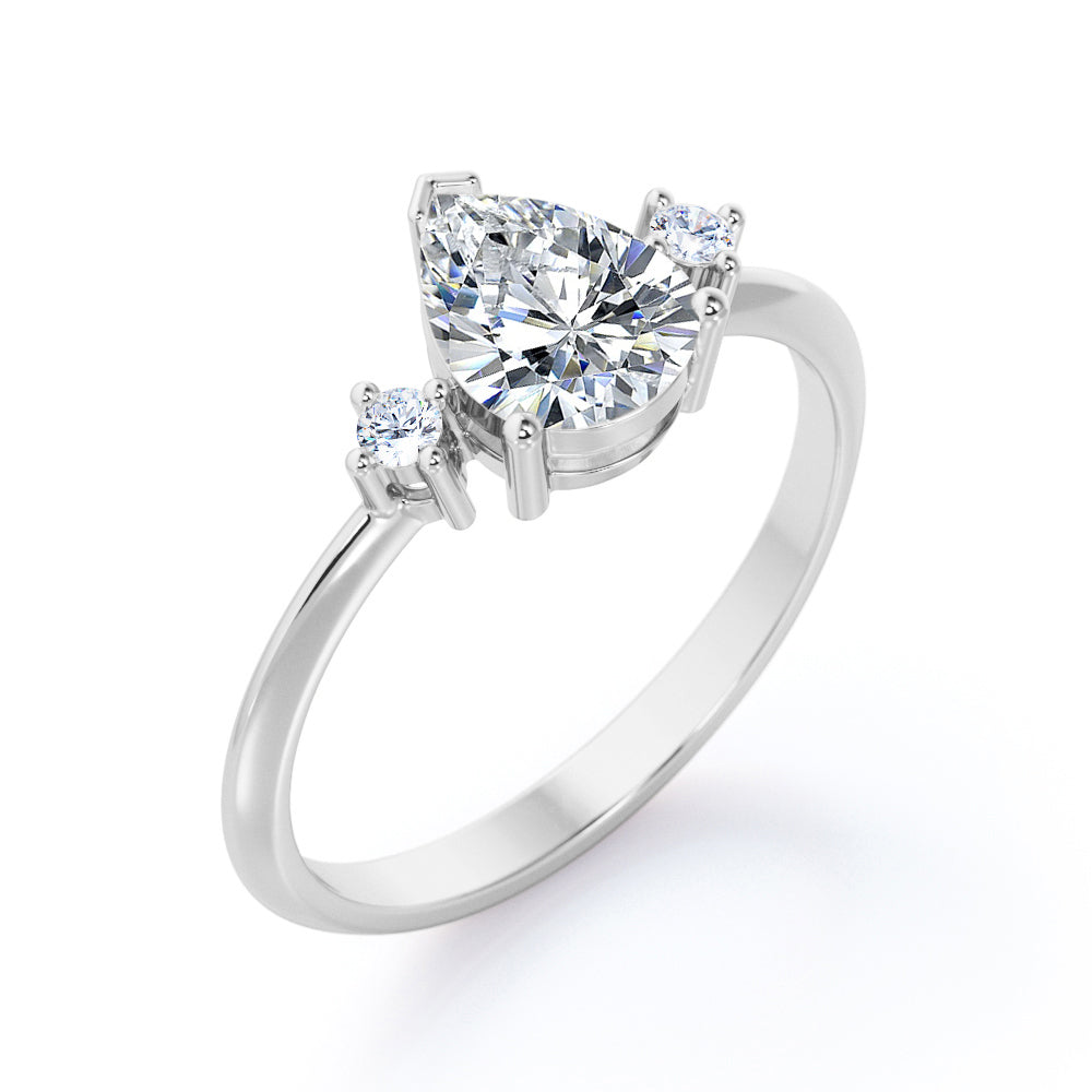 Classic Trinity 1 carat Pear shaped Moissanite and diamond-prong setting-pinched shank engagement ring in White gold