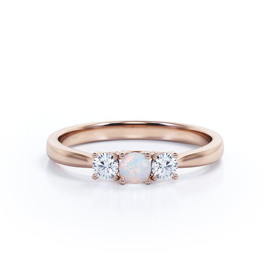 Tapered Shank 0.7 carat Round cut Ethiopian Opal and diamond triple stone engagement ring in Rose gold