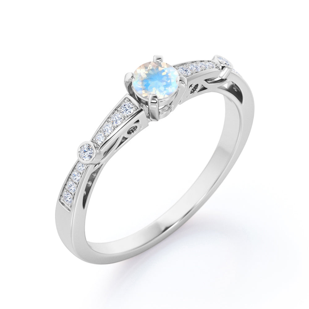 Basket set 1.25 carat Round cut Blue Moonstone and Diamond tapered shank engagement ring in Yellow gold