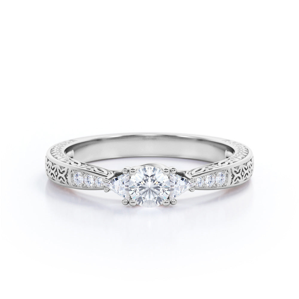 Tapered style 0.75 carat Round cut Moissanite and trillion cut diamond engagement ring in White gold