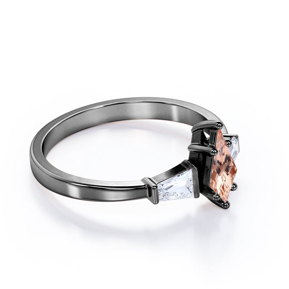Baguette style 1.1 carat Kite shaped Morganite and diamond three stone anniversary ring in Black gold