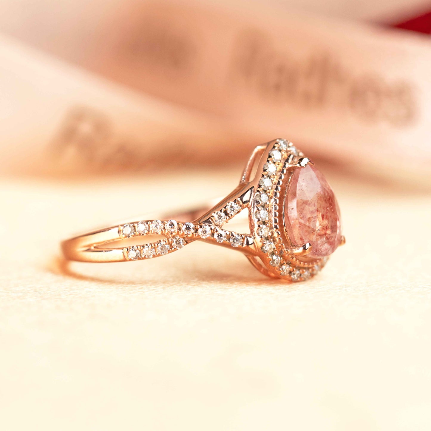 Halo 1.25 carat Pear Cut Strawberry Quartz and Diamond Half-mount Twist Shank Promise Ring in Rose Gold