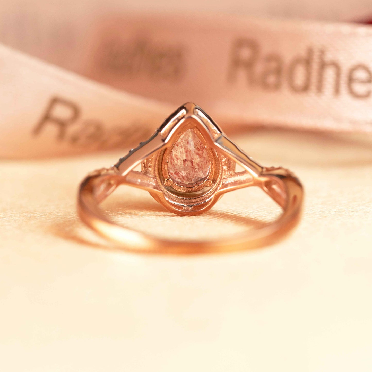 Halo 1.25 carat Pear Cut Strawberry Quartz and Diamond Half-mount Twist Shank Promise Ring in Rose Gold