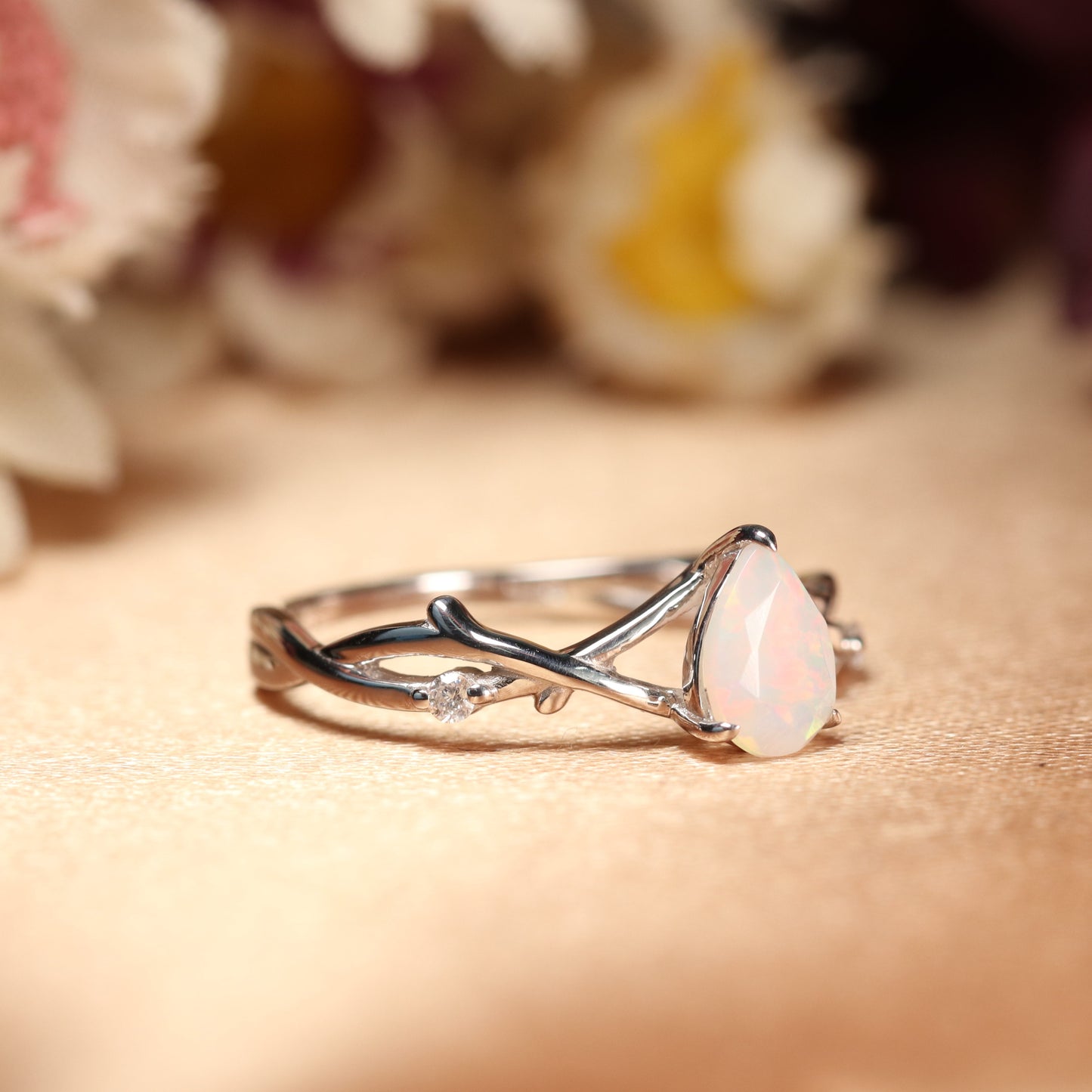 Nature-inspired 1.1 Carat Pear cut Fire Opal Twig Engagement Ring in White Gold