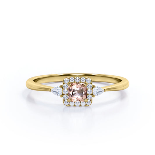 Exquisite three stone 0.75 carat Princess cut Peach Pink Morganite and diamond tapered style anniversary ring in Yellow gold