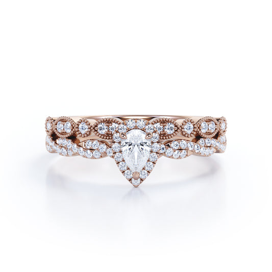 Vintage infinity 1.25 carat Pear shaped Moissanite and diamond milgrain and halo Bridal set in Rose gold