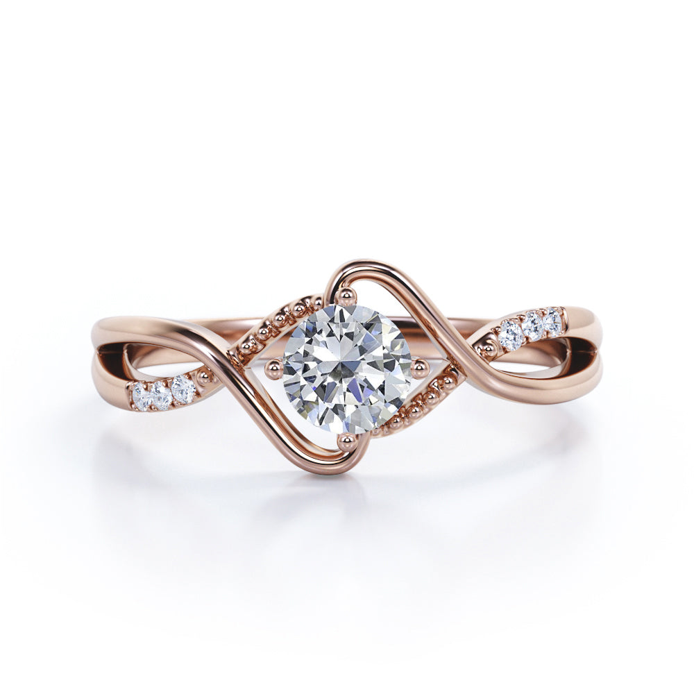 Vintage style twisted 1.25 Round cut Moissanite and diamond infinity engagement ring in Rose gold