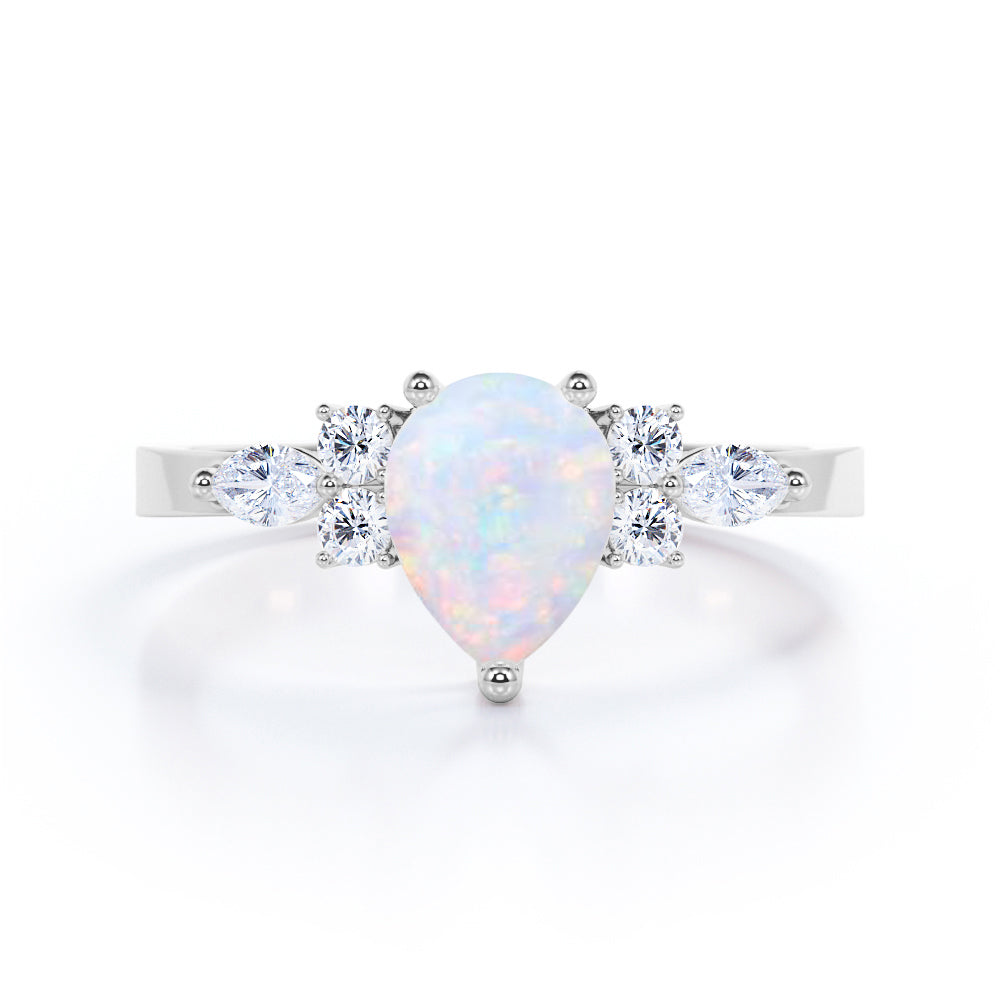 Authentic 7 stone 1.3 carat tear drop shape Opal and diamond 3 prong pear engagement ring in White gold