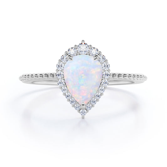 Antique Milgrain 1.2 carat Tear drop shape Fiery Opal and diamond halo engagement ring in White gold