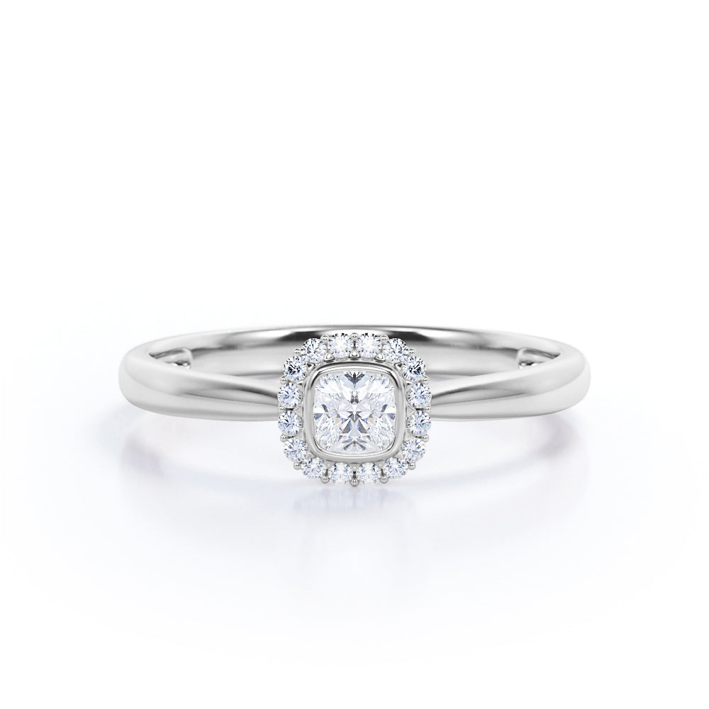 Halo solitaire 0.6 carat Cushion cut Moissanite and diamonds pinched shank engagement ring in yellow gold