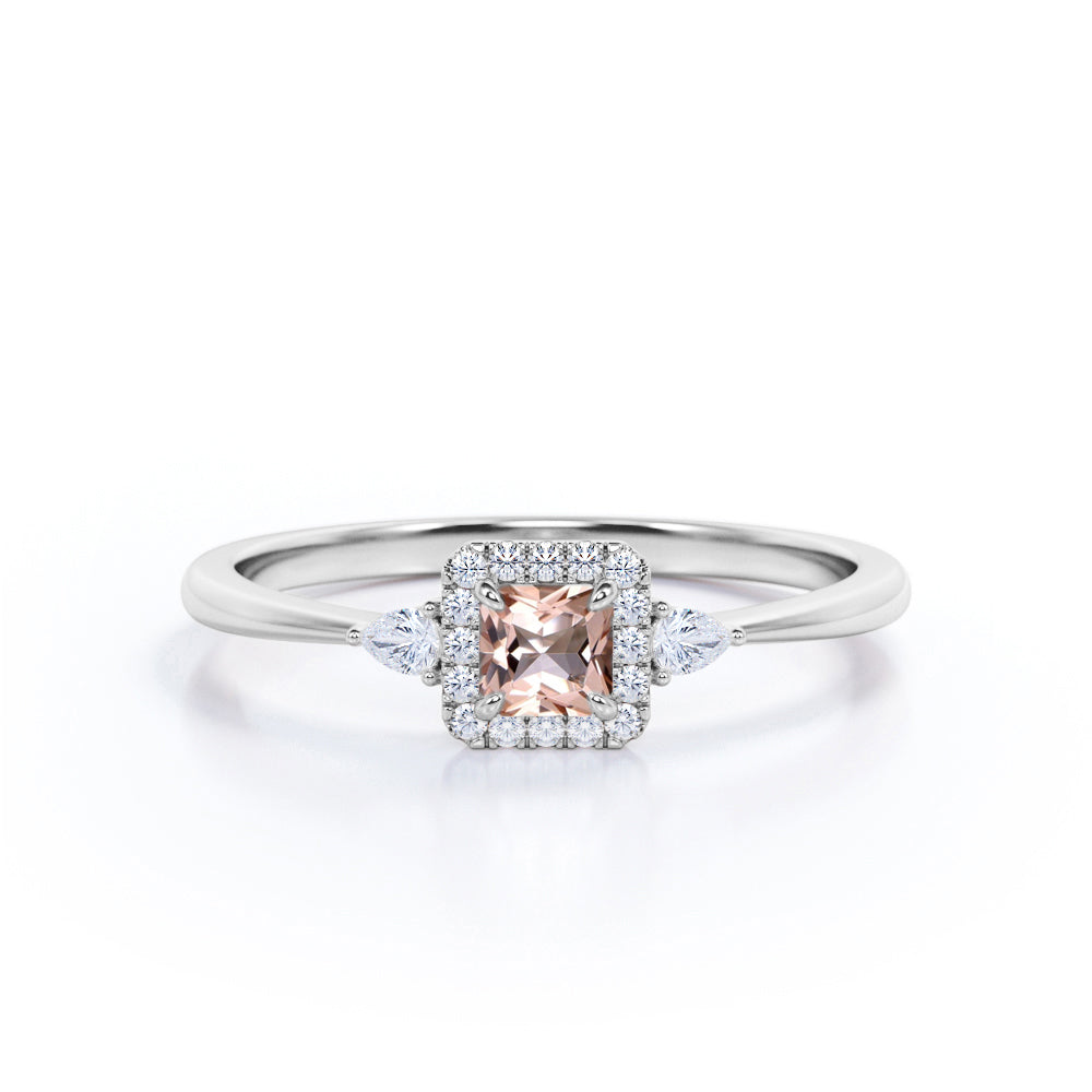 Exquisite three stone 0.75 carat Princess cut Peach Pink Morganite and diamond tapered style anniversary ring in Yellow gold