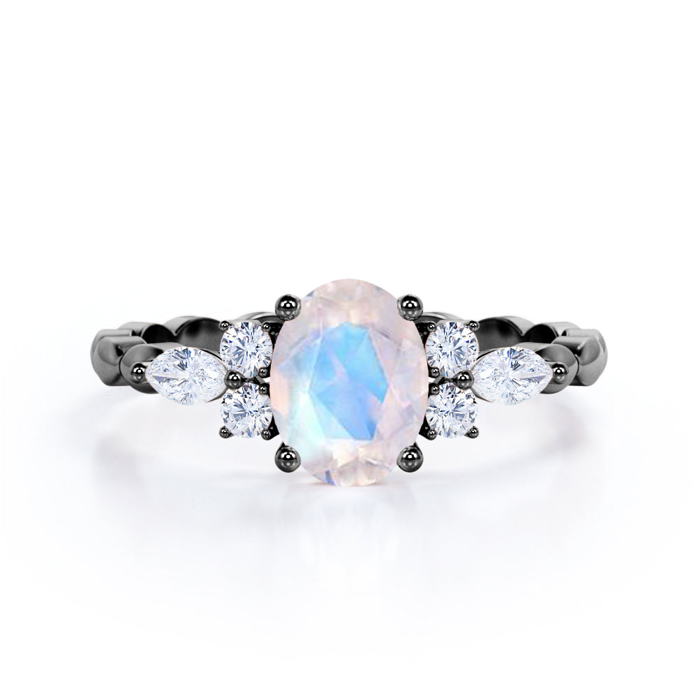 Scalloped Rope Design 1.15 carat Oval cut Moonstone and diamond 7 stone engagement ring in White gold