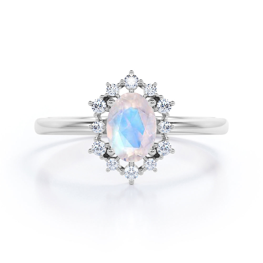 Snowflake inspired 1.25 carat Oval cut Moonstone and diamond unique halo engagement ring in Black gold