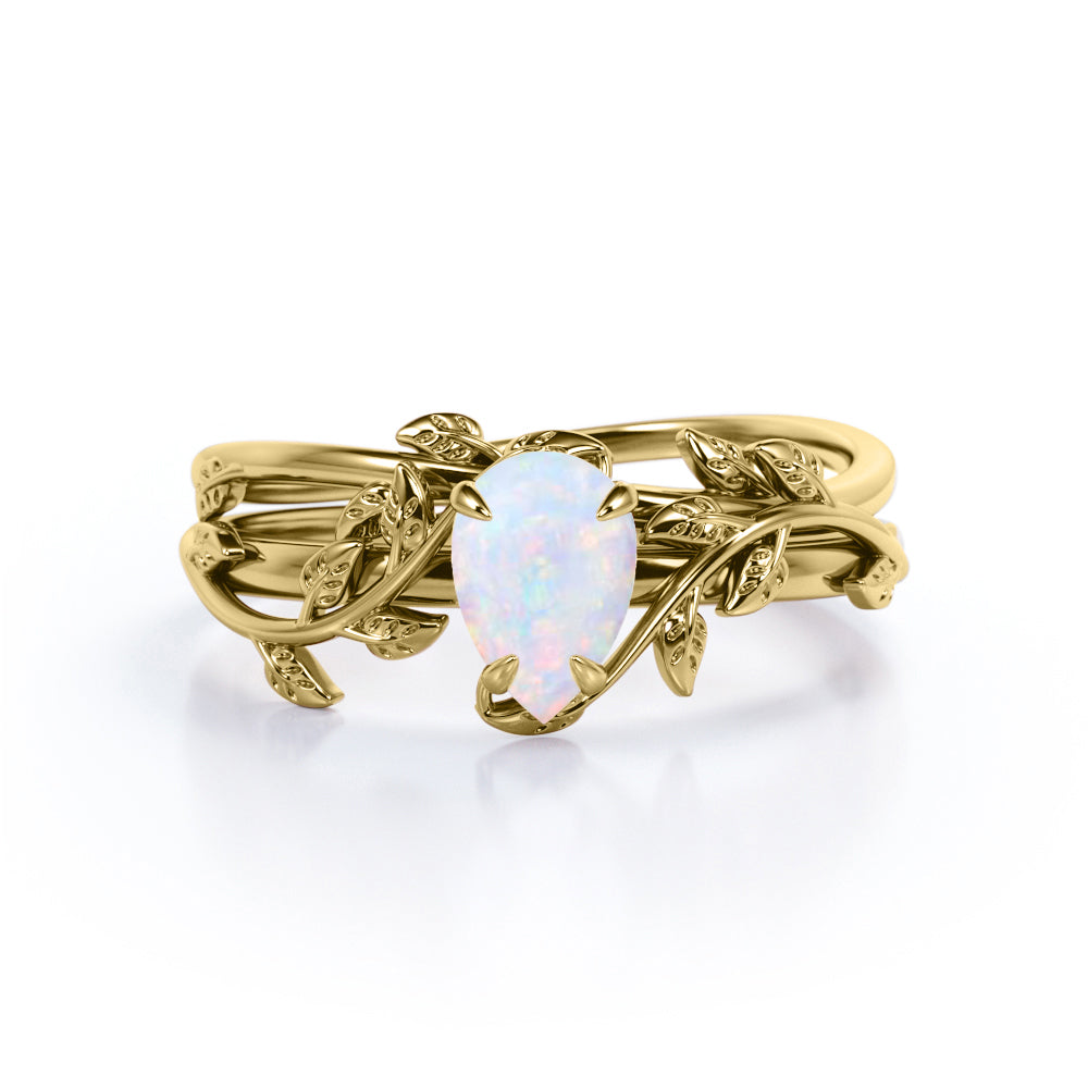 Eccentric 1 carat Pear cut Ethiopian Opal vine-leaf inspired Bridal ring set for women in White gold