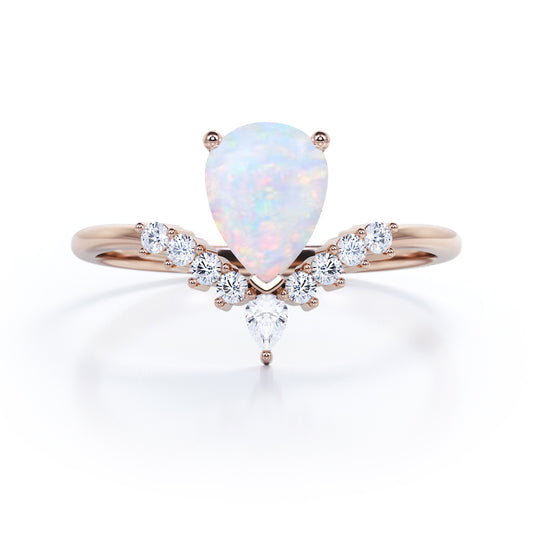 Elegant V-shaped 1.15 carat Pear cut Ethiopian Opal and diamond tiara style engagement ring in Rose gold