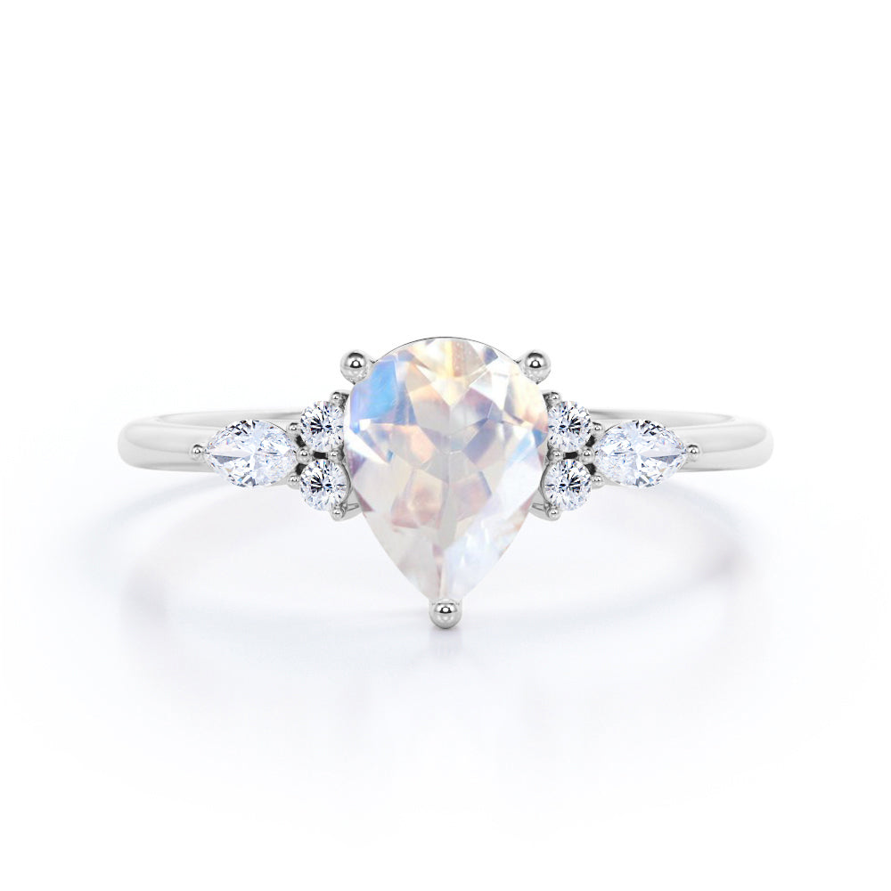 Art Deco inspired 1.2 carat Pear shaped Moonstone and diamond multistone engagement ring in Rose gold