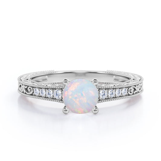 Vintage Edwardian style 1.1 carat Round cut Australian Boulder Opal and diamond filigree and milgrain engagement ring in White gold