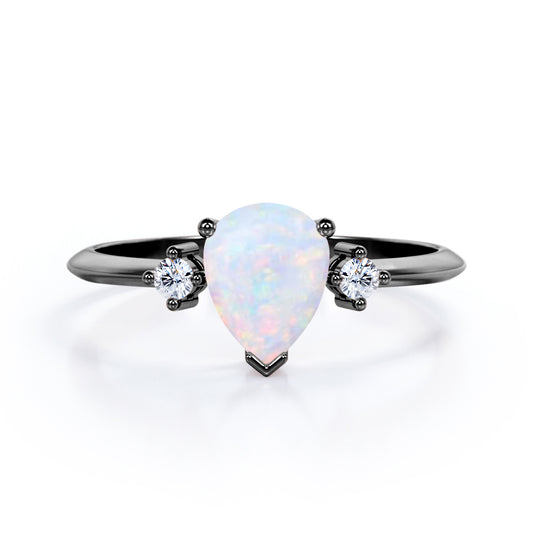 Elegant Three stone 1.10 carat Tear drop shape Ethiopian Opal and diamond pinched shank engagement ring in Black gold