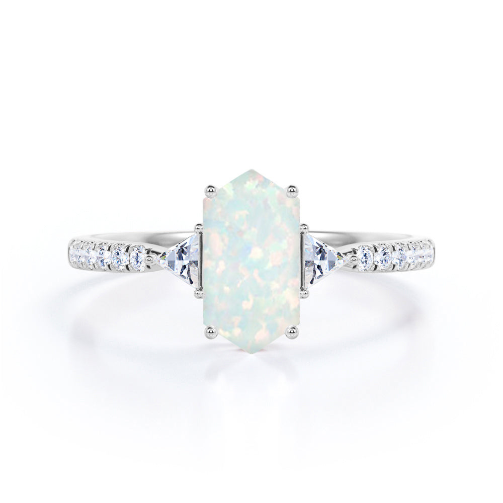 Quadrilateral 3 stone 1.25 carat Hexagon cut Welo Opal and diamond trillion engagement ring in Black gold