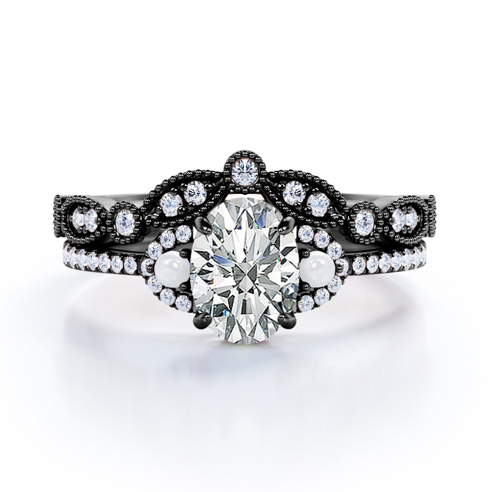 Artistic art deco inspired 1.5 carat Oval shaped Moissanite, diamonds and pearls milgrain wedding ring set for women in Black gold