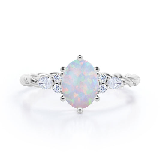 Twisted style 1.25 carat Oval shaped Opal and diamond 6 prong engagement ring in White gold