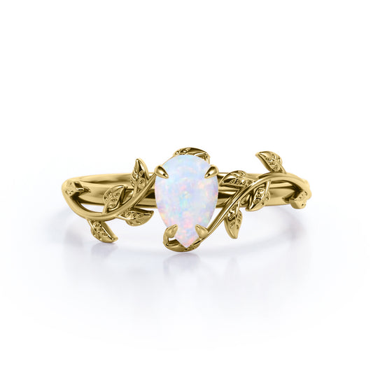 1 carat Pear cut Ethiopian Opal Vintage Engagement ring in Yellow gold