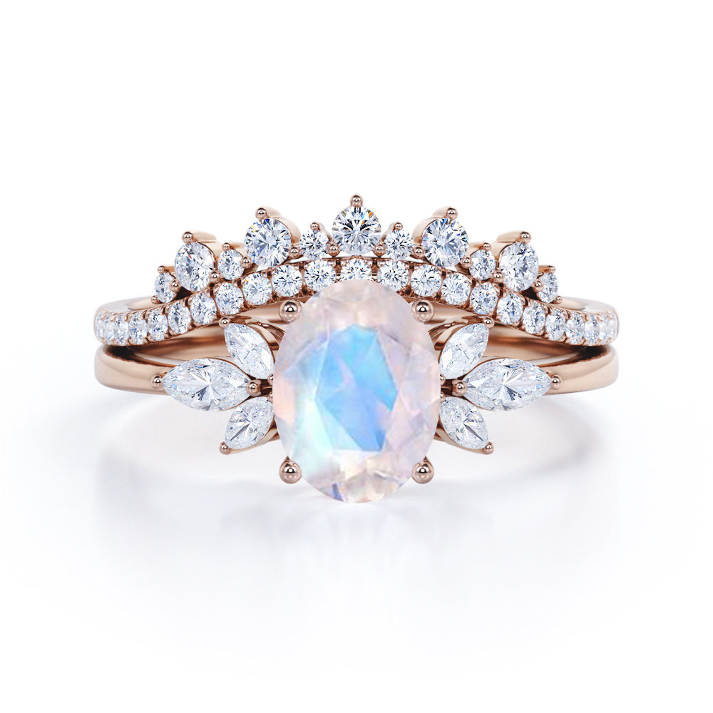 Garland Inspired 1.65 carat Oval shaped Blue Moonstone and diamond contoured seven stone Bridal set in Black gold