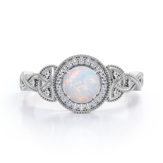 Grandiose 1.30 carat Round cut Ethiopian Opal and diamond twisted infinity halo engagement ring in White gold