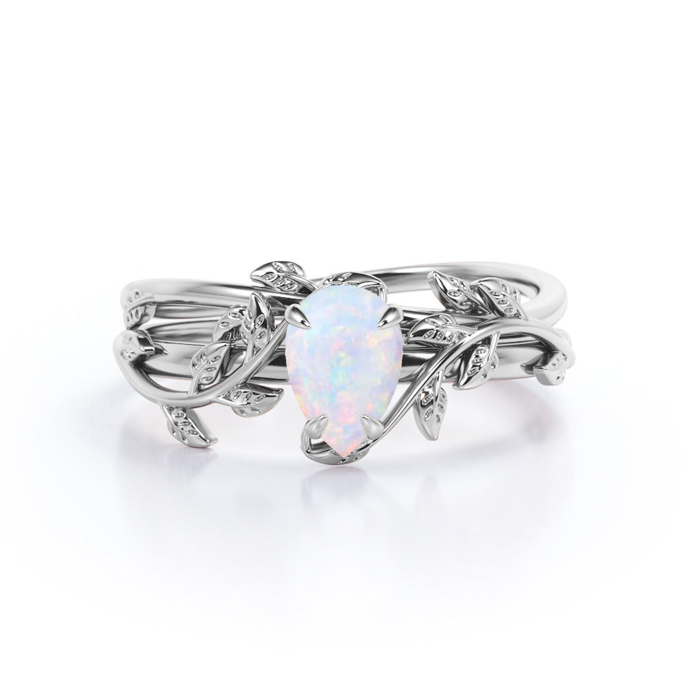 Eccentric 1 carat Pear cut Ethiopian Opal vine-leaf inspired Bridal ring set for women in White gold