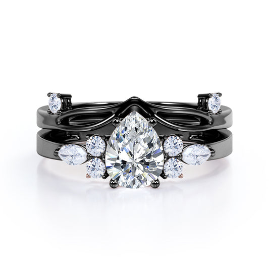Split shank Chevron 1.2 carat tear drop shaped Moissanite and diamond art deco style engagement ring in Black gold