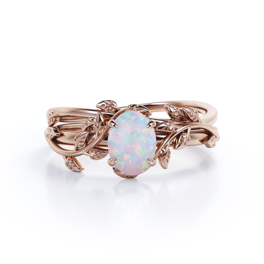 Delicate 1 carat Oval Shaped Ethiopian Opal Nature-inspired Vintage style Engagement ring in Rose gold