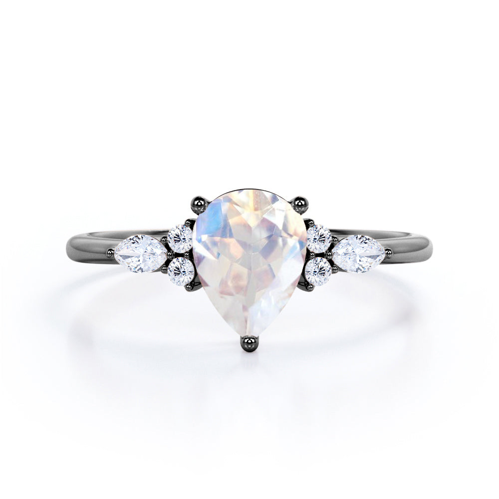 Art Deco inspired 1.2 carat Pear shaped Moonstone and diamond multistone engagement ring in Rose gold