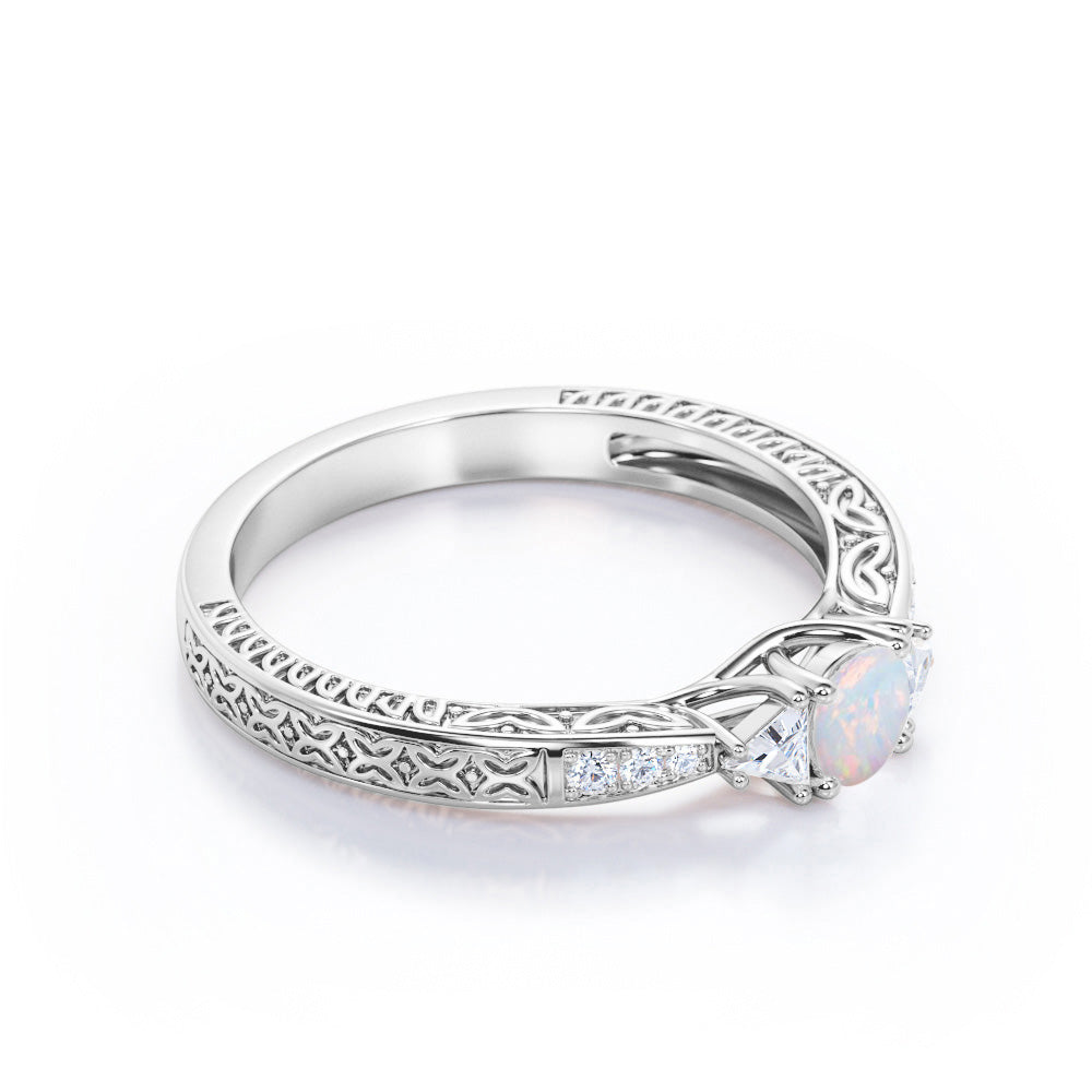 Contemporary style Filigree 0.75 carat Round cut Ethiopian Opal and diamond triangle engagement ring for her