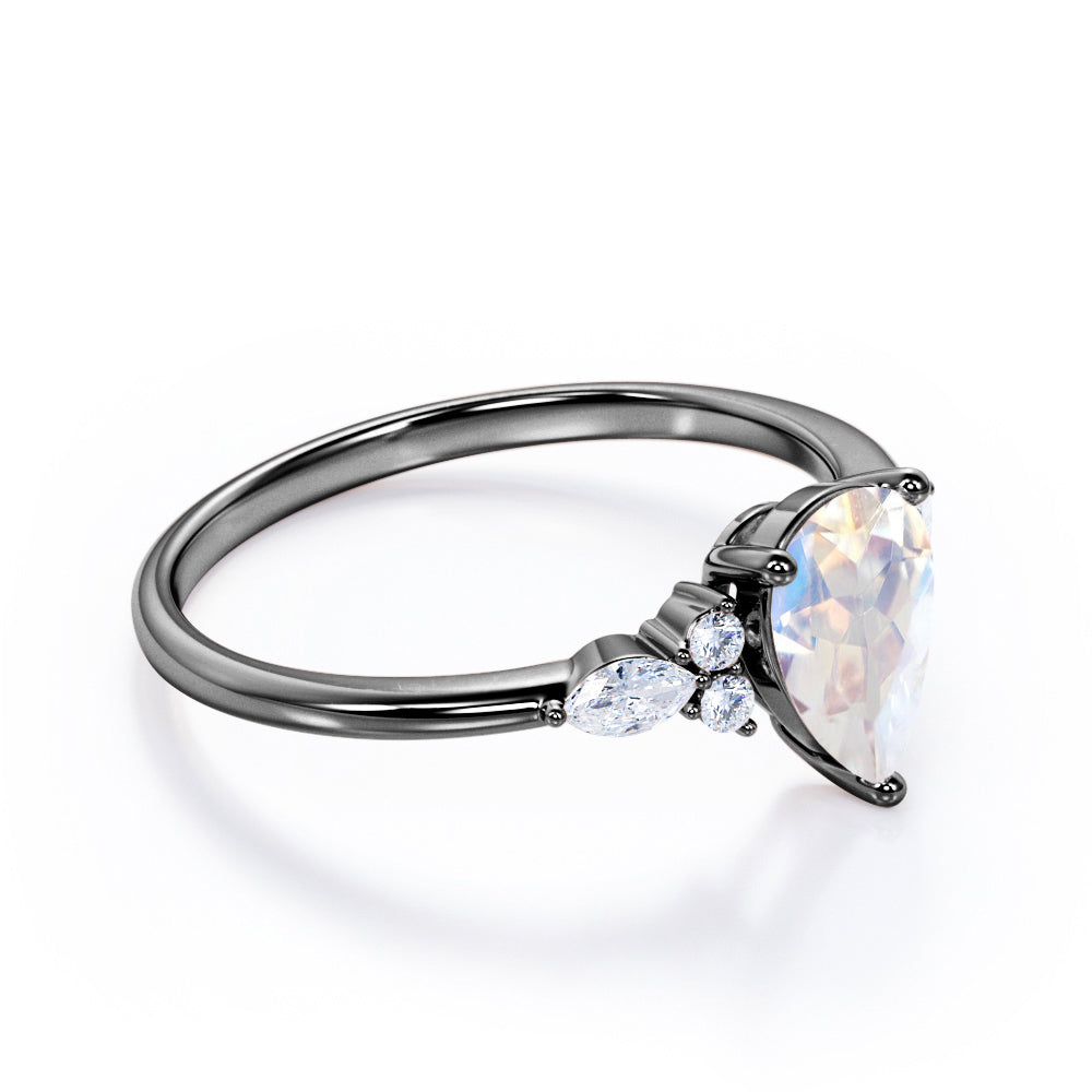 Art Deco inspired 1.2 carat Pear shaped Moonstone and diamond multistone engagement ring in Rose gold