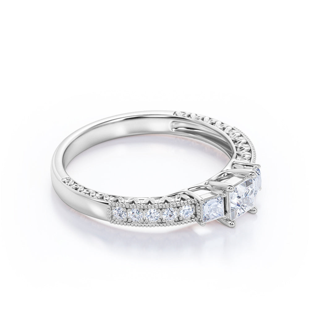 Eccentric triple stone 0.5 carat Princess cut diamond art deco wedding ring set in gold