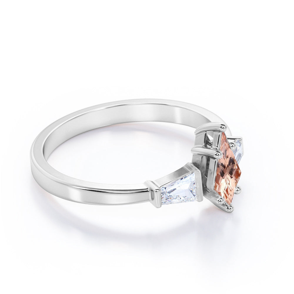 Baguette style 1.1 carat Kite shaped Morganite and diamond three stone anniversary ring in Black gold