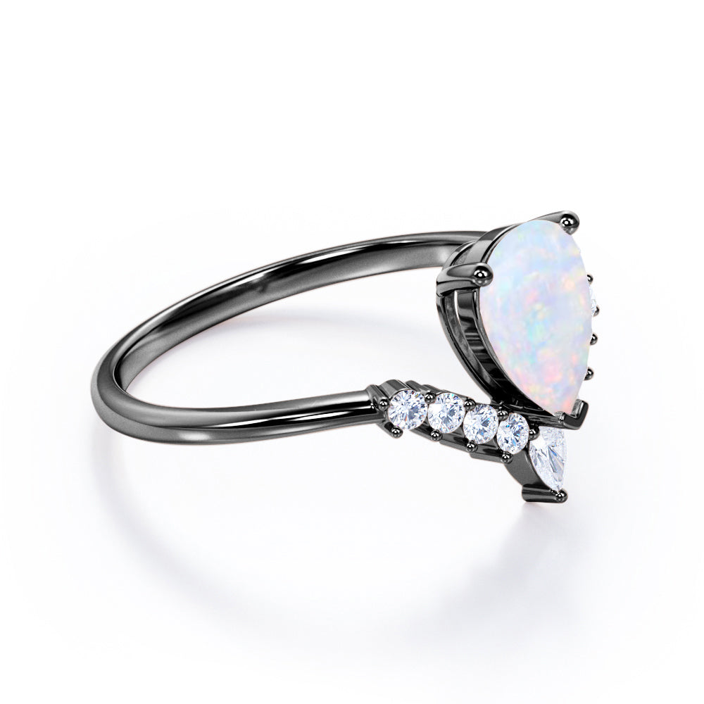 Elegant V-shaped 1.15 carat Pear cut Ethiopian Opal and diamond tiara style engagement ring in Rose gold