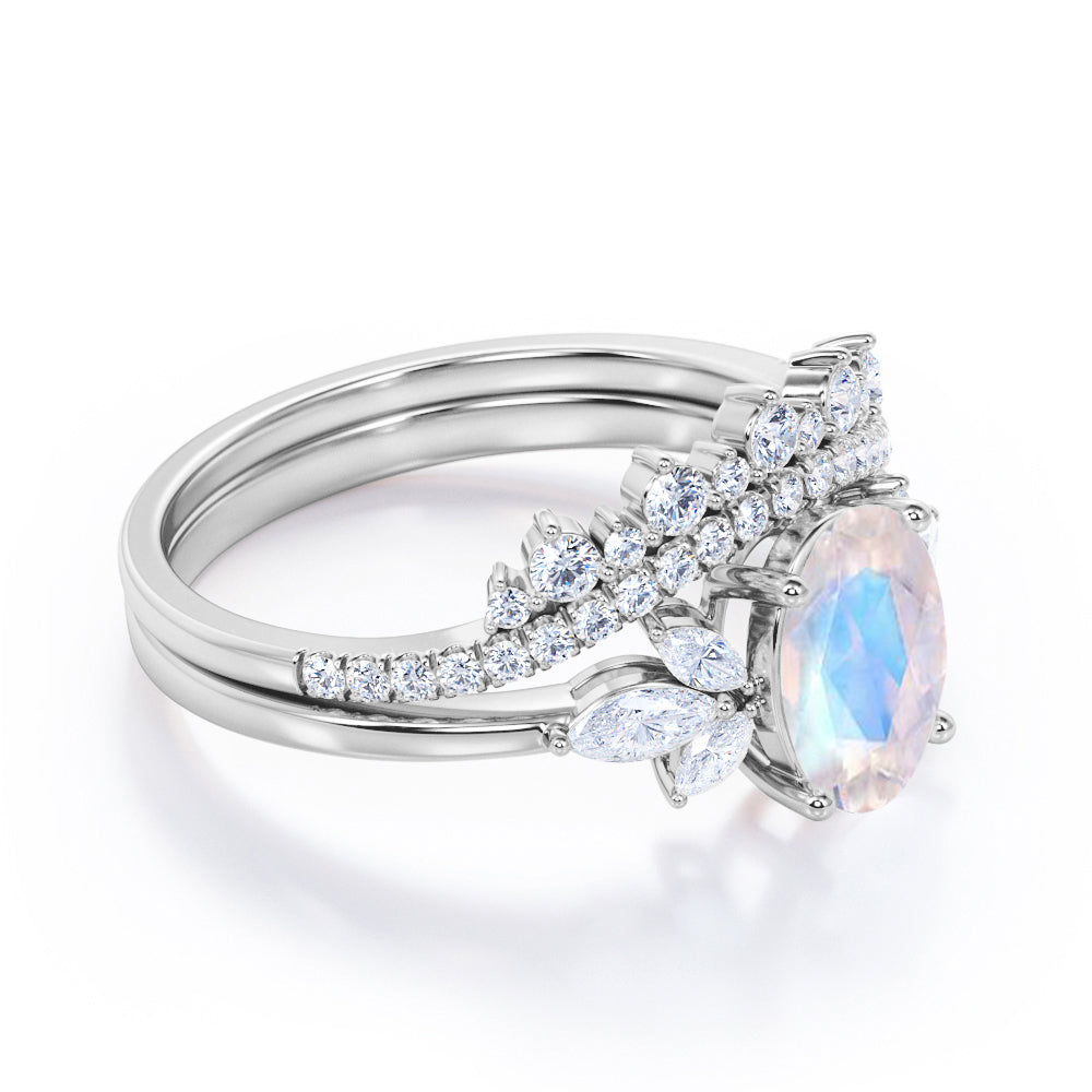 Garland Inspired 1.65 carat Oval shaped Blue Moonstone and diamond contoured seven stone Bridal set in Black gold