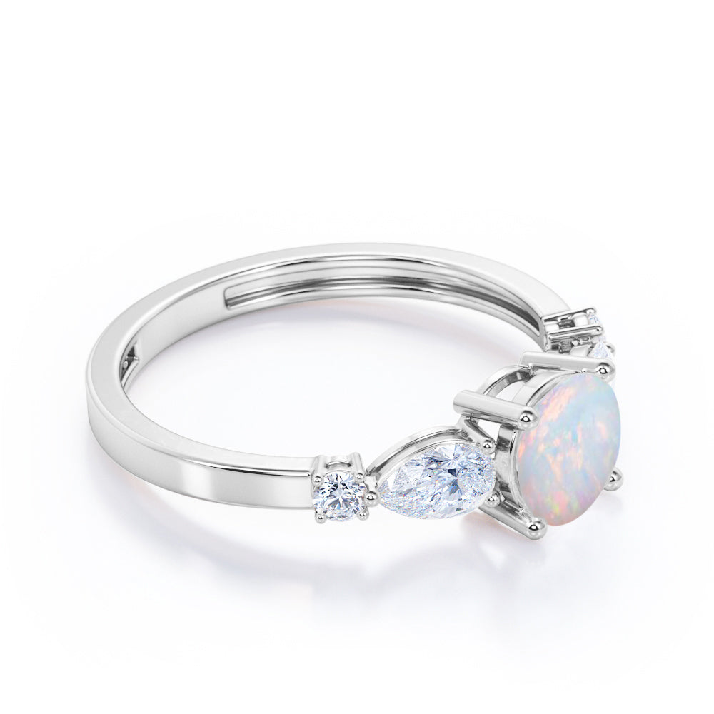 Eccentric 1.25 carat Round cut Ethiopian Opal and marquise and dot diamond engagement ring in Rose gold