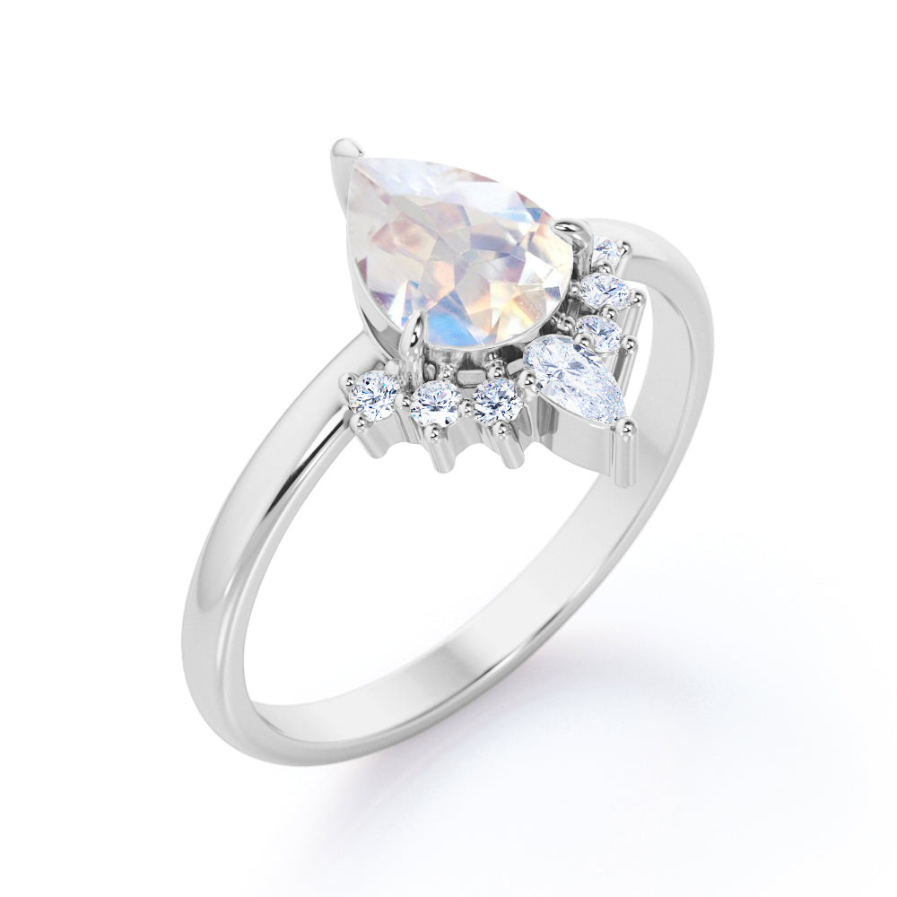 Crown Tiara inspired 1.2 carat Pear cut Rainbow Moonstone and diamond prong style engagement ring in Rose gold