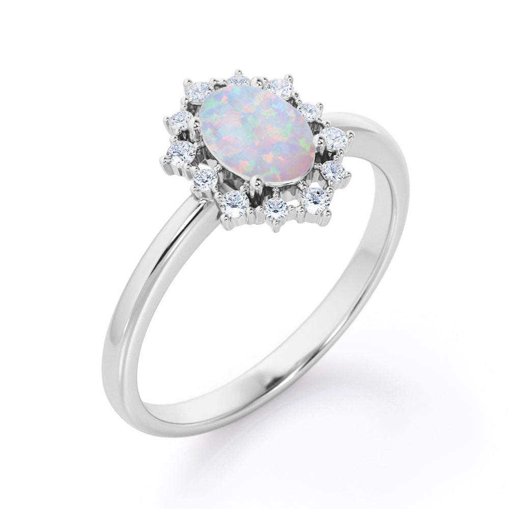 Intricate cluster 1.15 carat Oval cut Ethiopian Opal and diamond art deco engagement ring in Black gold