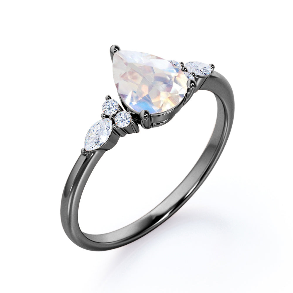 Art Deco inspired 1.2 carat Pear shaped Moonstone and diamond multistone engagement ring in Rose gold