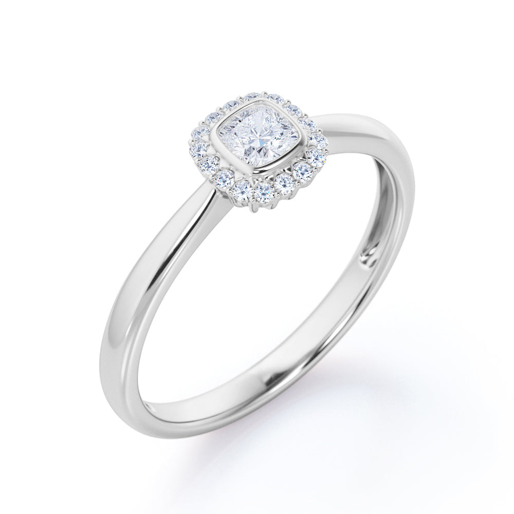 Halo solitaire 0.6 carat Cushion cut Moissanite and diamonds pinched shank engagement ring in yellow gold