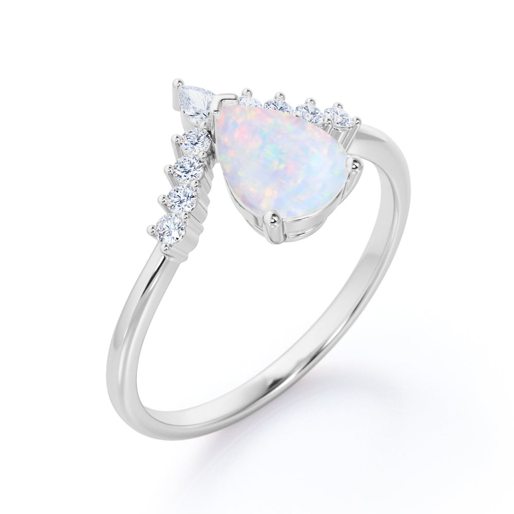 Elegant V-shaped 1.15 carat Pear cut Ethiopian Opal and diamond tiara style engagement ring in Rose gold